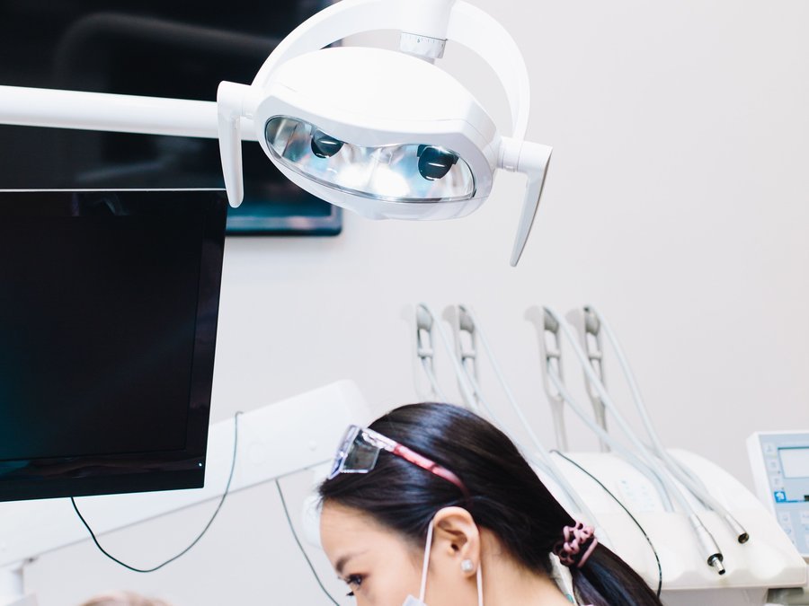 Dentist examining a patient in a modern dental clinic
