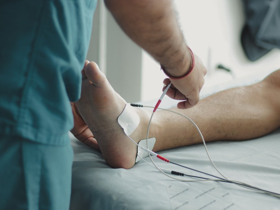 Physiotherapist conducting a nerve function assessment